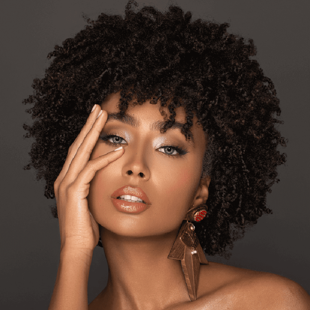 Bella Garnet Contact Lenses, warm brown and gray blend, daily collection, Model with Bella Garnet lenses, warm brown-gray eyes, statement earrings, Garnet daily contact lenses, natural enhancement, soft brown and gray tones
