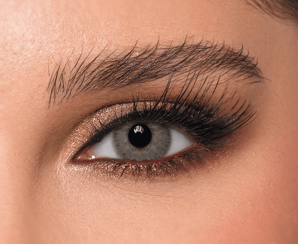 Close-up of eye wearing Silver Lace DYE Monthly Contact Lenses in Dusty Gray color