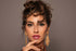 Bella Onyx DYE Dark Brown Contact Lenses, Daily Collection, Bella Onyx DYE contact lenses, elegant dark brown look, daily collection, Model with Bella Onyx DYE dark brown lenses, gold statement earrings, Dark brown eyes with Bella Onyx DYE lenses, natural