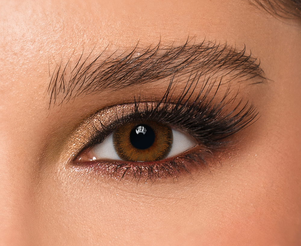 Close-up of eye wearing Stormy DYE Monthly Contact Lenses in Chocolate Brown